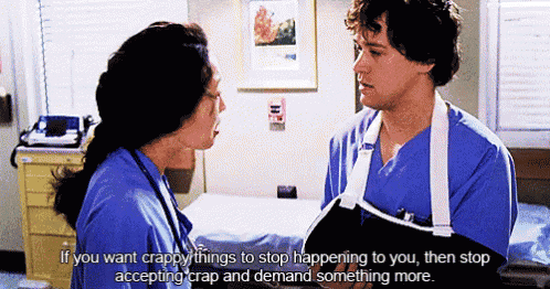 a man with a broken arm talks to a woman in a hospital room