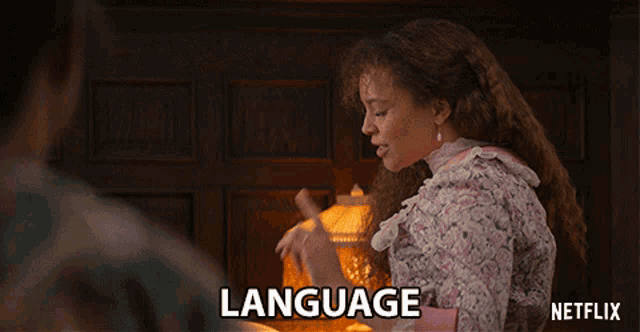 a netflix ad shows a woman in a pink dress talking about language