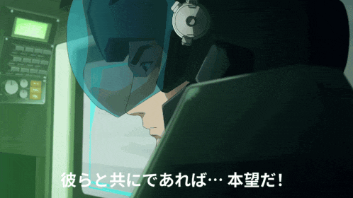 a man wearing a helmet and headphones is looking at a screen with chinese writing below him