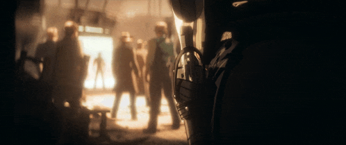 a blurred image of a group of people standing in a room