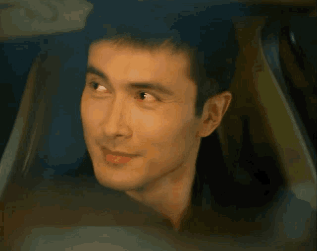 a close up of a man 's face with a blurred background