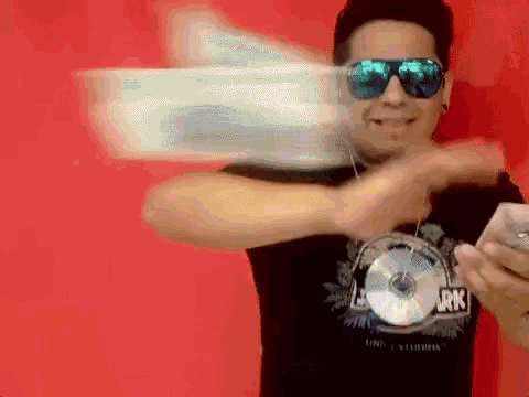 a man wearing sunglasses and a shirt that says junk