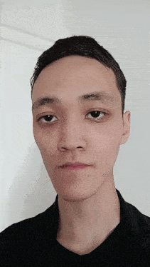 a close up of a man 's face with a serious look on his face