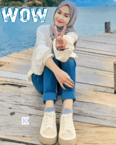 a woman sitting on a wooden dock with the word wow behind her