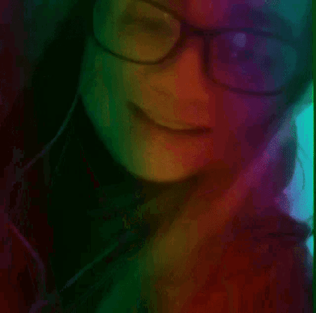a woman wearing glasses and headphones with a rainbow background