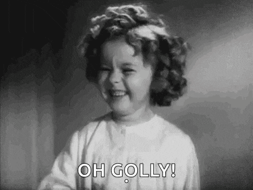a black and white photo of a little girl making a funny face and saying oh golly .
