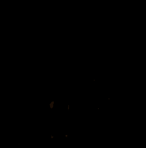 a rocket is being launched in the dark with a crane in the background