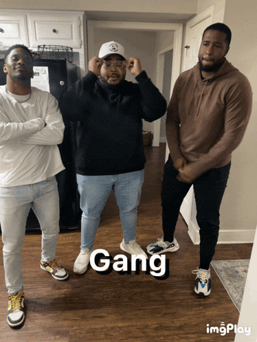 a group of men standing next to each other with the word gang on the bottom