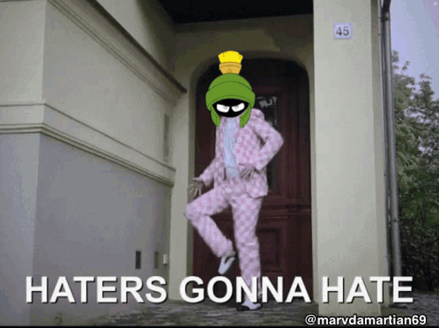 a cartoon of marvin the martian standing in front of a door with the words haters gonna hate below him