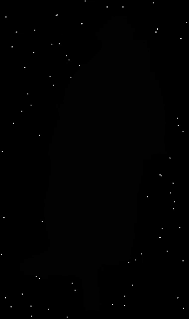 a black background with white dots floating in the air