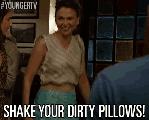 a woman says shake your dirty pillows in a video