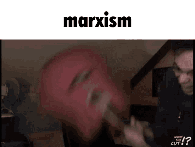 a man wearing a red mask is being attacked by another man with a knife .
