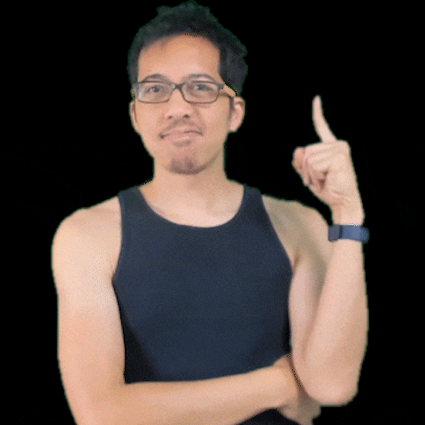a man wearing glasses and a black tank top is pointing upwards