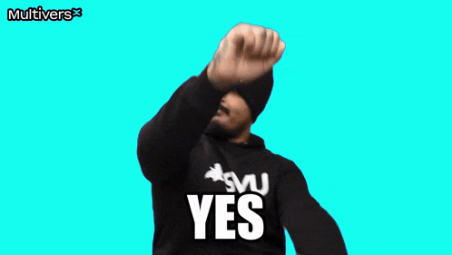 a man wearing a black sweatshirt that says yes on it