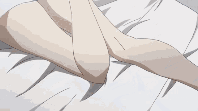 a girl with blue hair is laying on a bed with white sheets