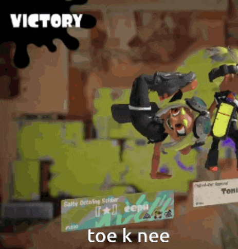 a video game character is doing a handstand and the words victory are above him