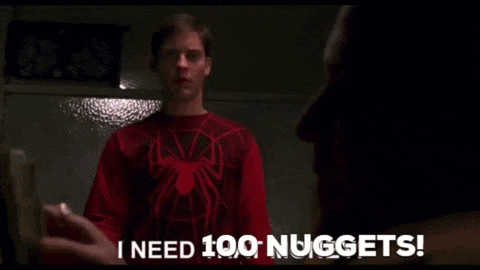 a man in a spider man shirt says i need 100 nuggets .