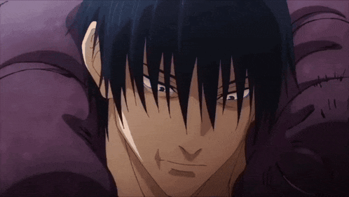 a close up of a man 's face with dark hair