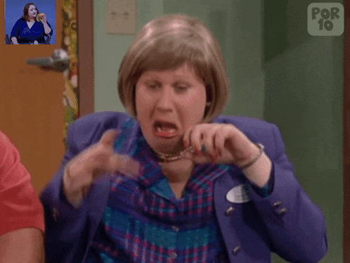 a woman is making a funny face in front of a door that says por 10 on it
