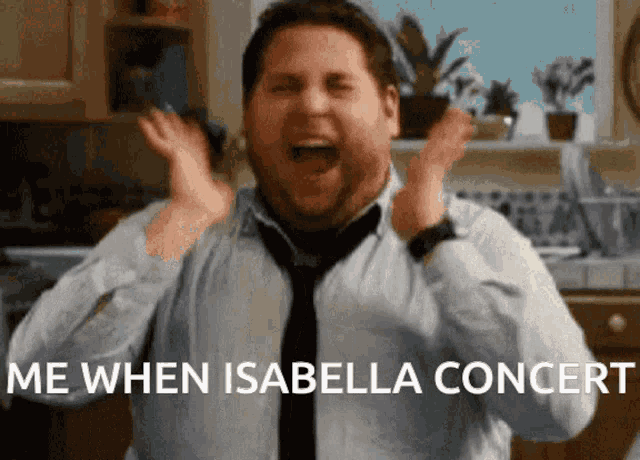 a man in a tie is screaming with the words " me when isabella concert " written below him