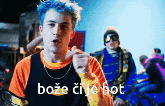 a young man with blue hair is wearing a shirt that says boze ci je hot on it