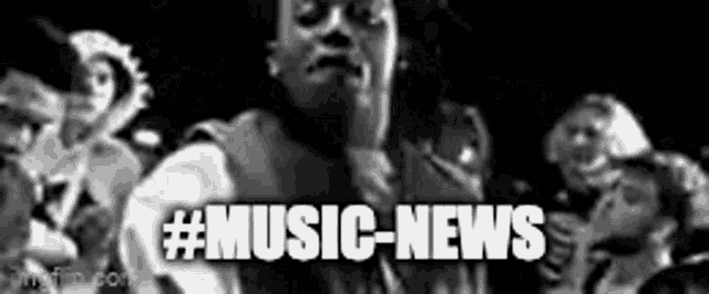a black and white photo of a man standing in front of a crowd with the words `` music news '' written on it .