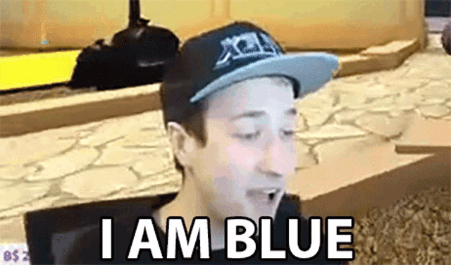 a young man wearing a hat says i am blue