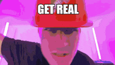 a man wearing a red hat that says get real