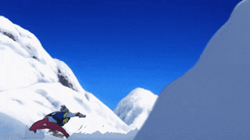 a snowboarder is jumping off a snow covered cliff