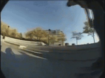 a blurry picture of a person riding a skateboard on a street