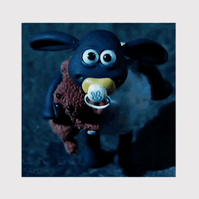 a cartoon sheep with a pacifier in his mouth