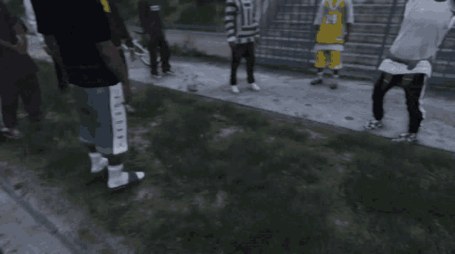 a man in a yellow jersey with the number 24 on it is dancing