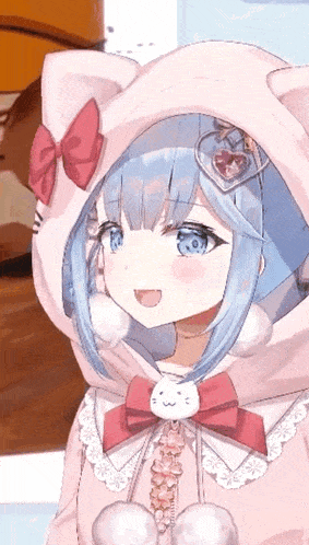 a girl with blue hair and blue eyes is wearing a pink hoodie with ears .