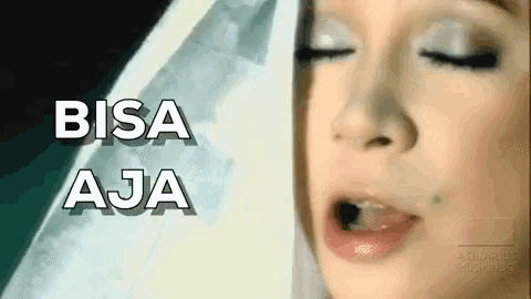 a close up of a woman 's face with the words bisa aja written in white letters .