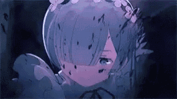 a close up of a person 's face with a flower in her hair .