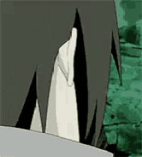 a close up of a person 's face with a green background and a white shirt .