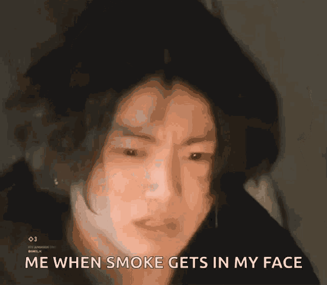 a close up of a person 's face with the words me when smoke gets in my face written on it