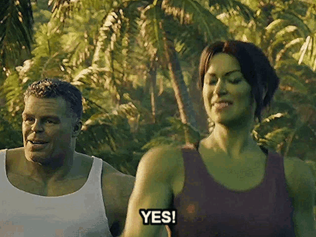 a man and a woman are standing in the jungle and the woman is saying yes .