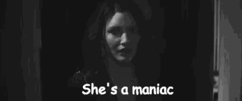 a woman is screaming in a black and white photo with the words `` she 's a maniac '' .