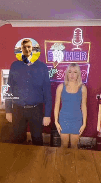 a man and a woman are standing in front of a neon sign that says " like father like son "