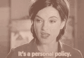 a woman is standing in front of a wall and saying `` it 's a personal policy '' .