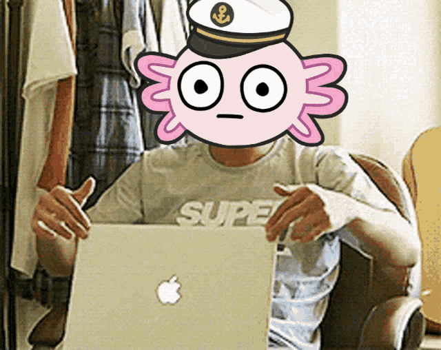 a person with an axolotl on their head using an apple laptop