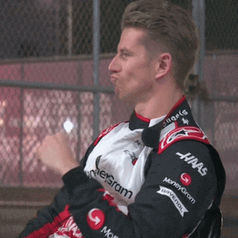 a man wearing a jacket that says haas moneygram on it
