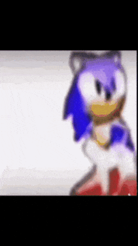 a blurry picture of a cartoon character , sonic the hedgehog , standing on a white background .