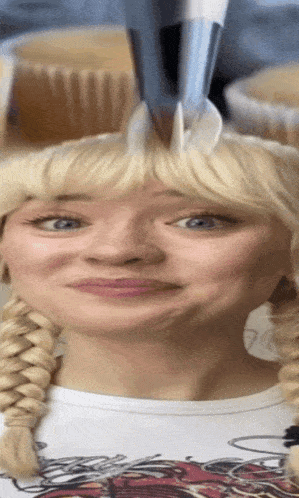 a woman with blonde hair is making a funny face with a fork in her hair