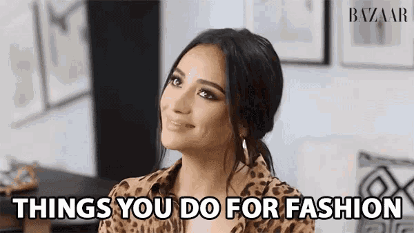 a woman in a leopard print shirt is smiling with the words things you do for fashion below her