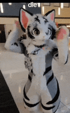 a stuffed animal with the word die on the bottom right