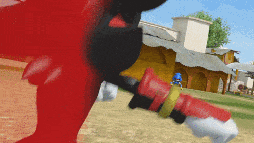 a cartoon character is holding a red object in front of a yellow building