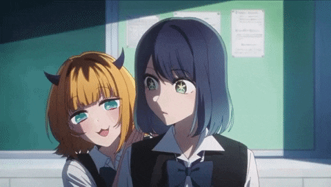 two anime girls with horns are standing next to each other