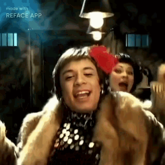 a man in a fur coat and headphones is dancing with a woman in a fur coat .